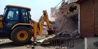 khargon.,Bulldozers ran , houses of those accused 